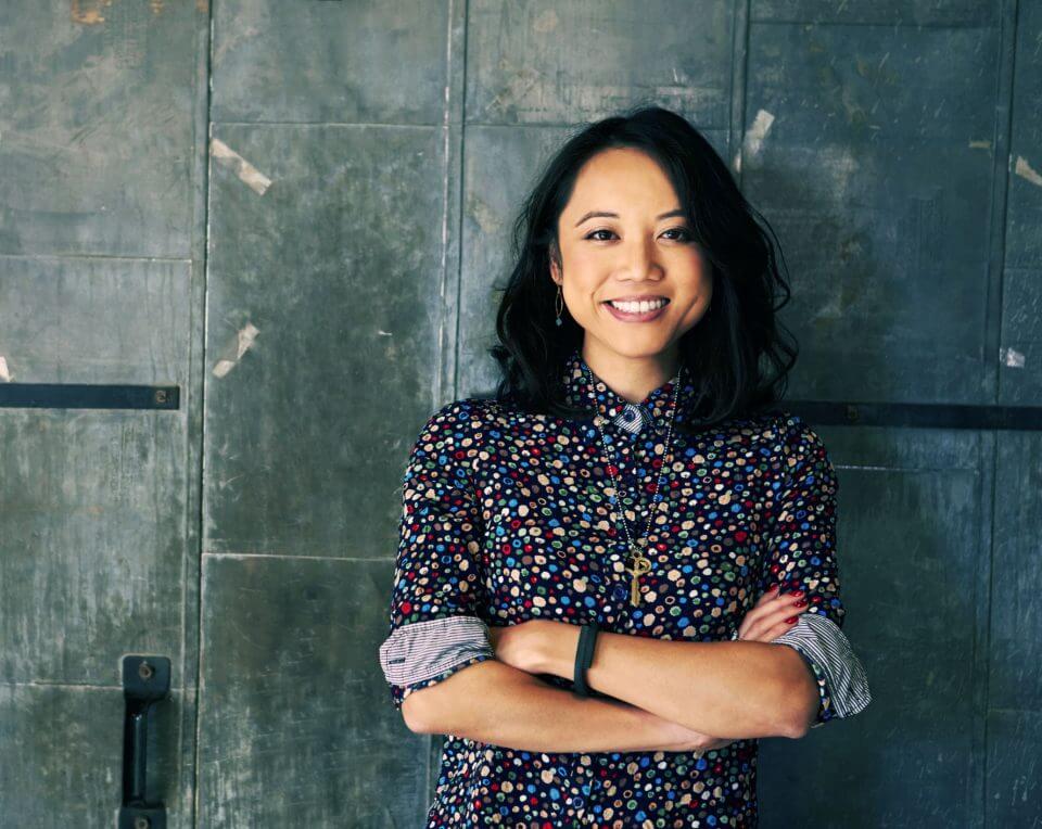 Portrait-Of-Female-Designer-Standing-In-Modern-Office-502176756_2125x1416